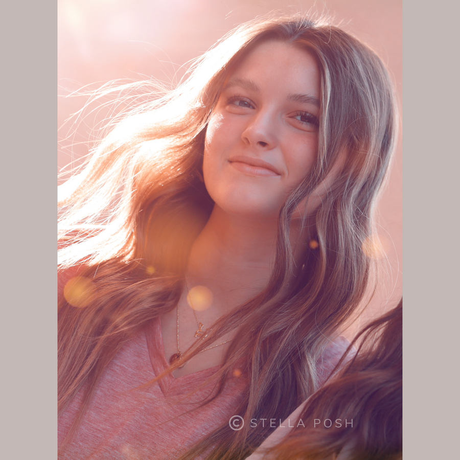 Teen Model wearing Dainty .925 Sterling Silver Indoor Exercise Cycle Necklace, layered with a Charm Necklace.