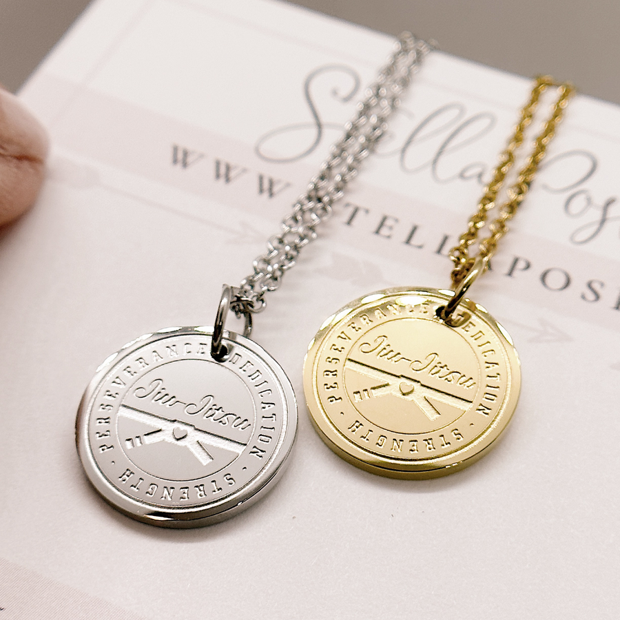 Jiu Jitsu Disc Charm Necklace shown  in gold and silver.