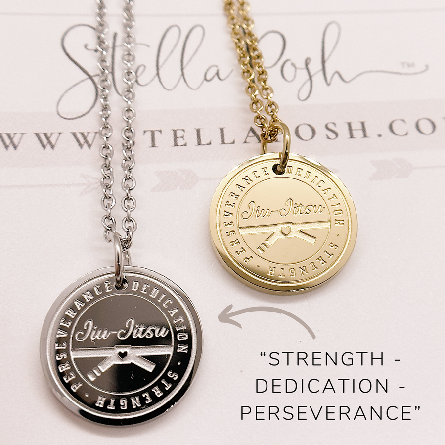 Jus Jitsu disc Charm Necklace shown in gold and silver. Strength - Dedication - Perseverance.