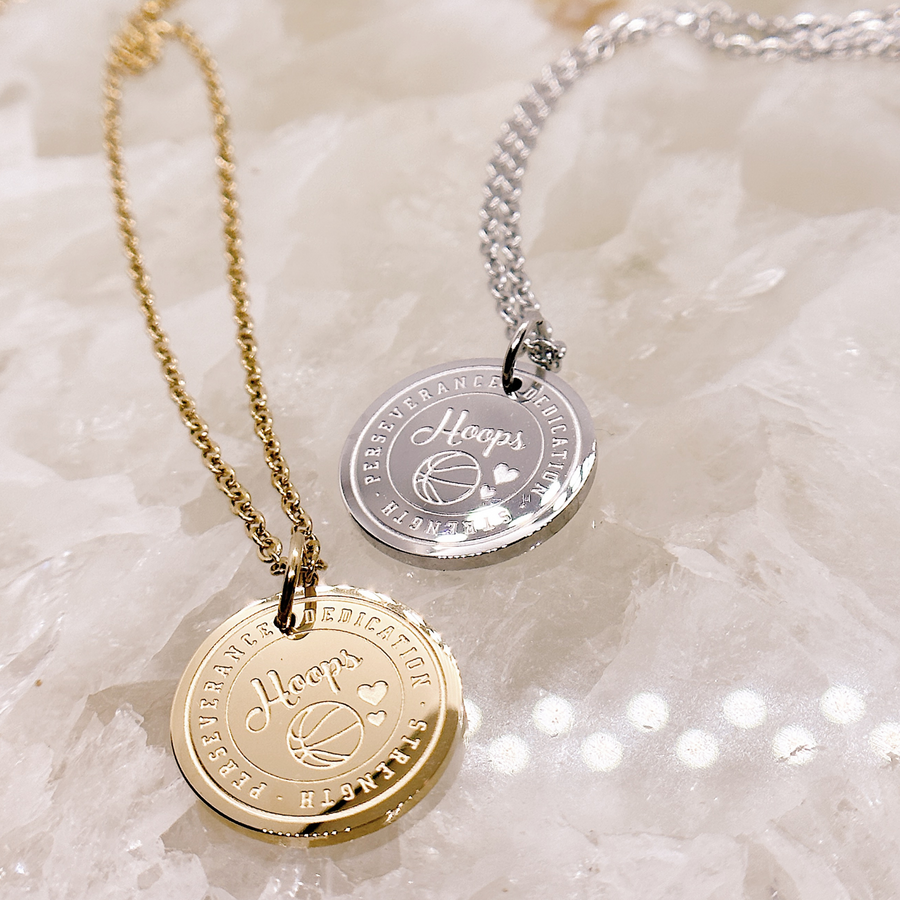 Basketball charm necklaces in gold and silver.