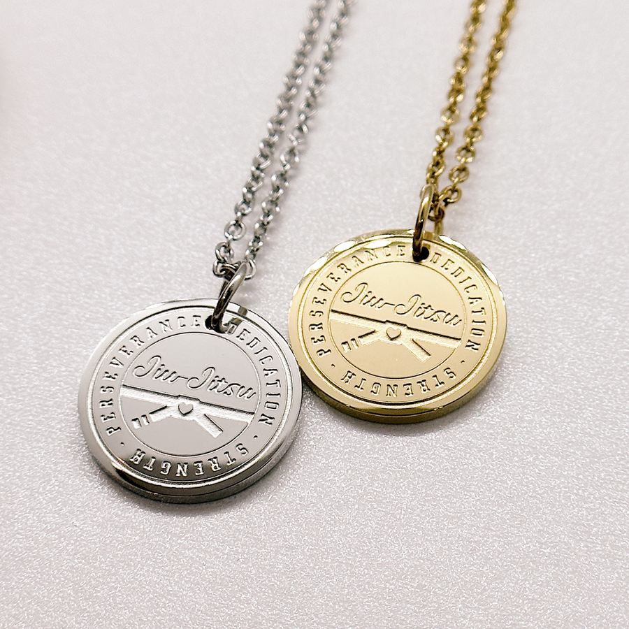 Jiu Jitsu disc charm necklaces in gold and silver.