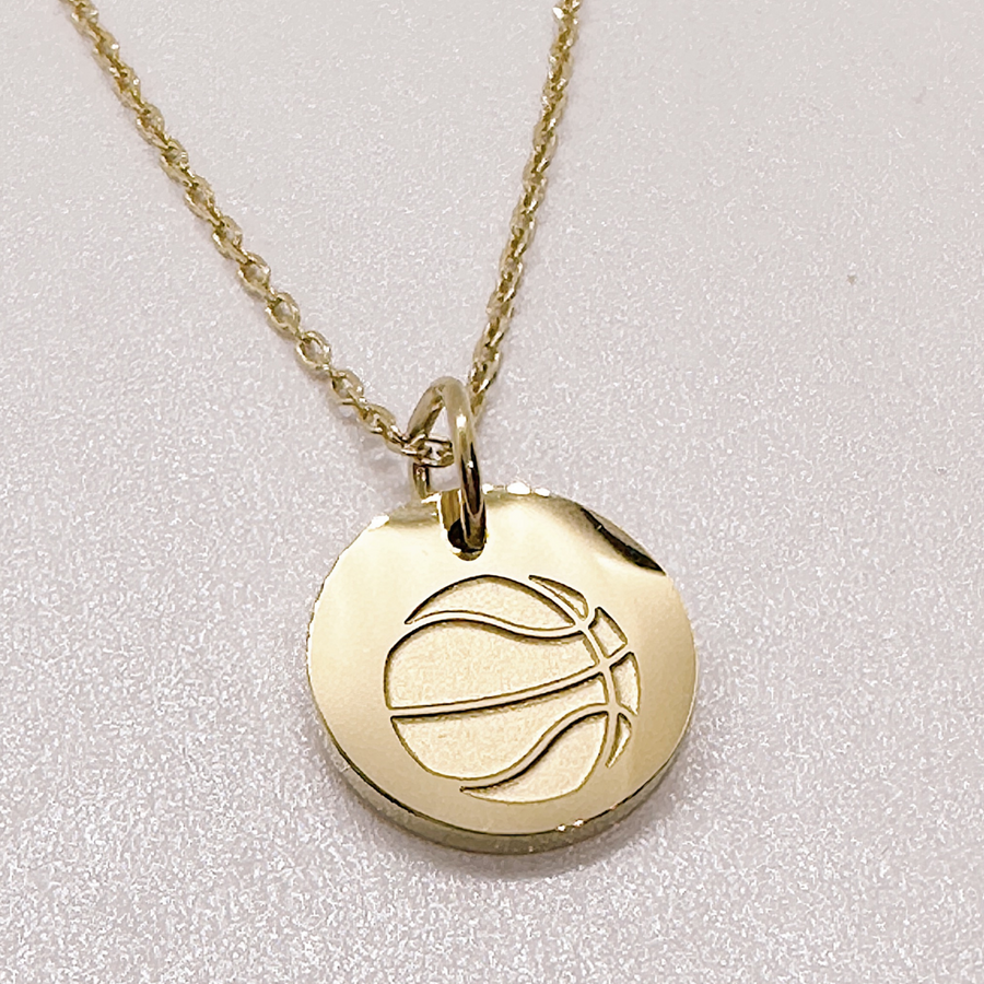 Tiny basketball necklace in gold.