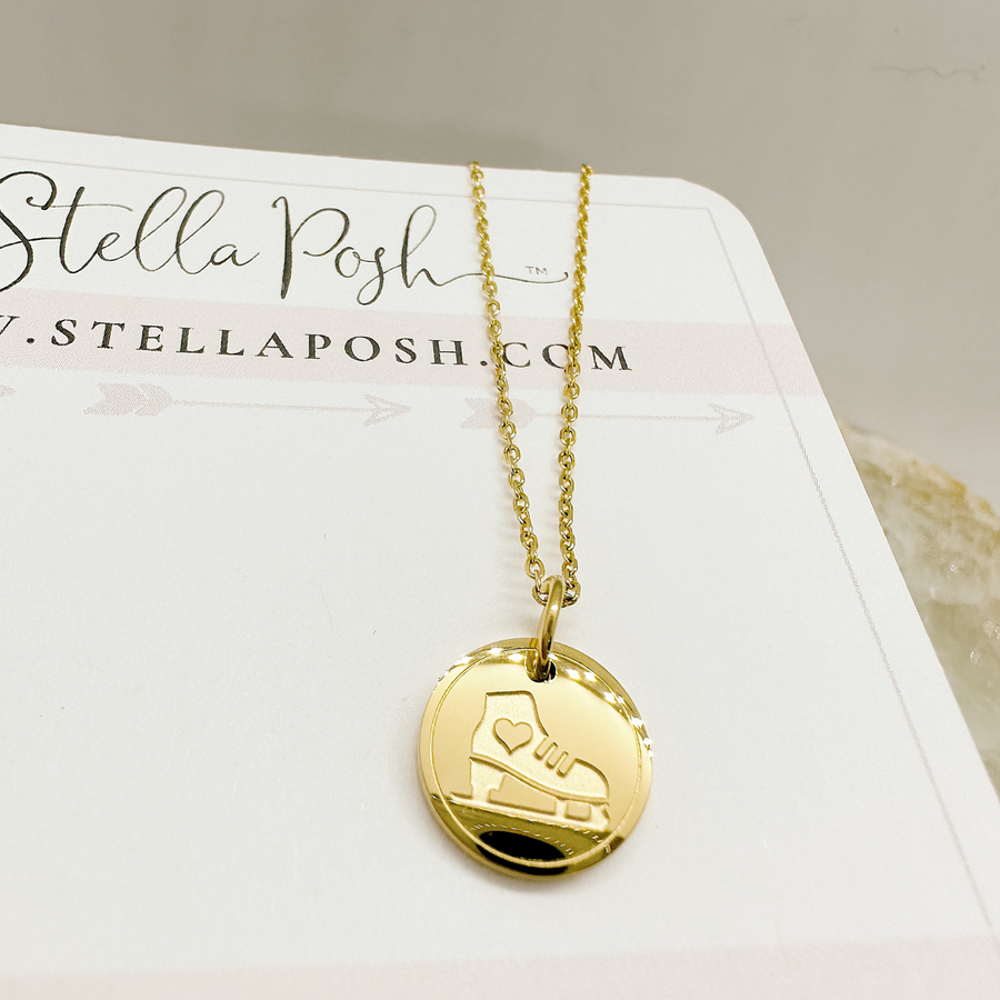Gold ice skate disc charm necklace.