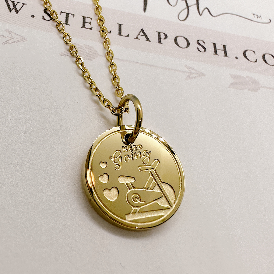 Gold indoor cycle fitness disc charm necklace.