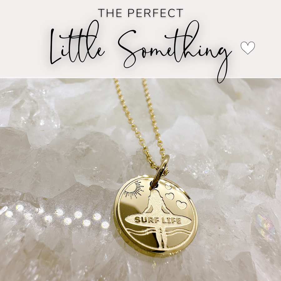 That perfect little something, surfer disc charm necklace.