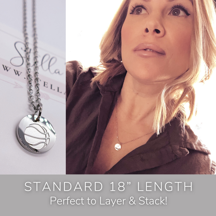 Model wearing stackable basketball disc charm necklace.