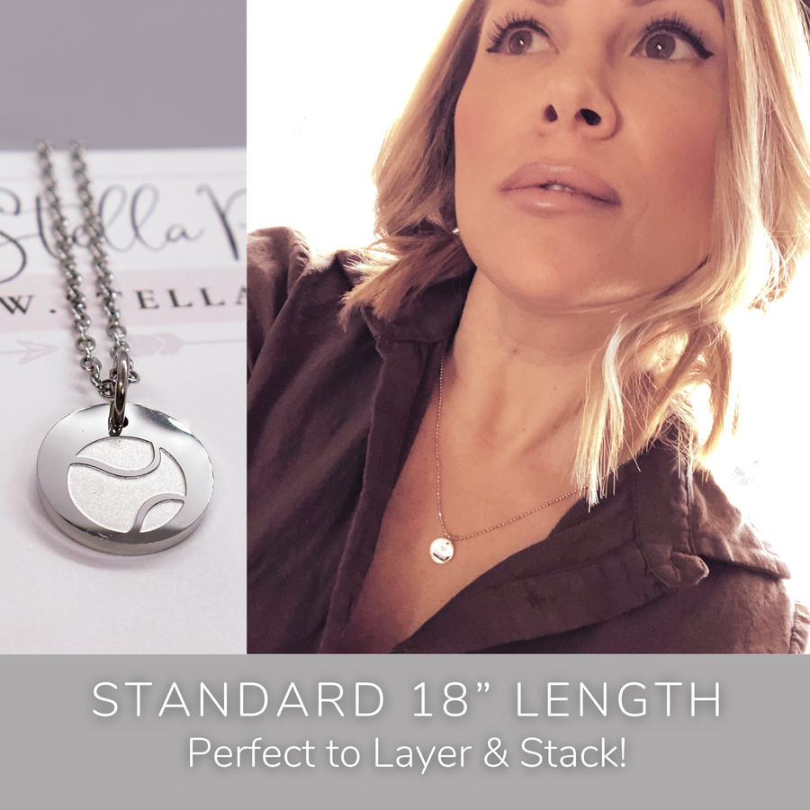 Model wearing stackable disc charm necklace. Perfect to Layer and Stack!