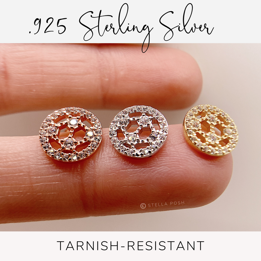 Tarnish resistant Tiny .925 Sterling Silver Soccer Earrings with premium cubic zirconia stones in a pavé setting, in gold, silver, and rose gold, held on finger for scale.