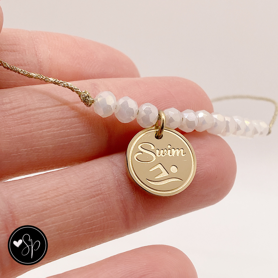Swim Life Charm Bracelet with 14K Gold plated 'Swim' charm.