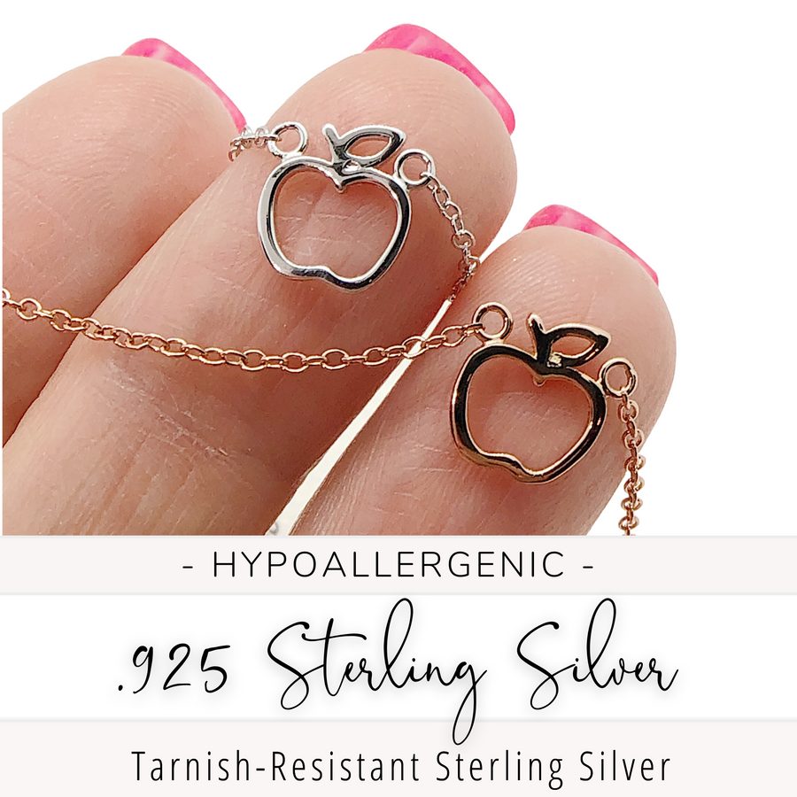 Beautiful and dainty hypoallergenic .925 sterling silver Apple Necklaces in gold and silver, held in hand for scale.