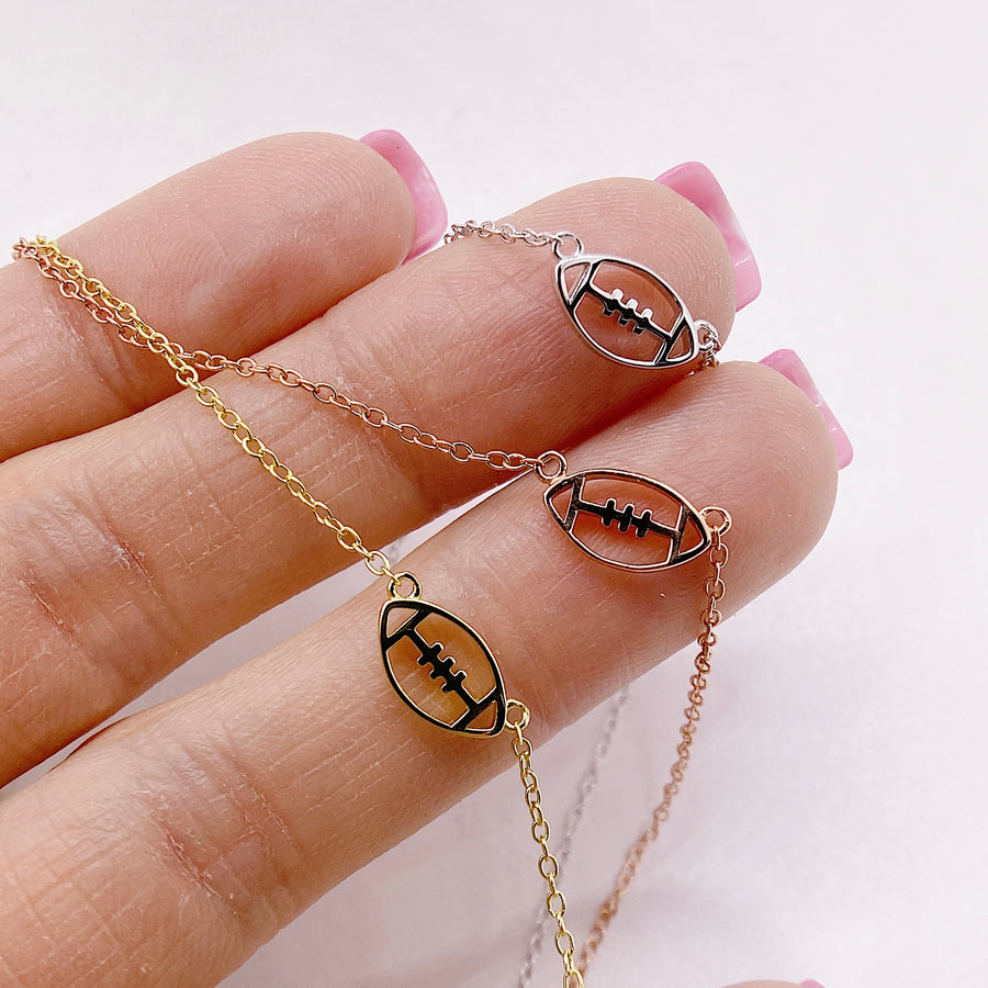 Tiny Football .925 silver necklaces in gold, silver, and rose gold.