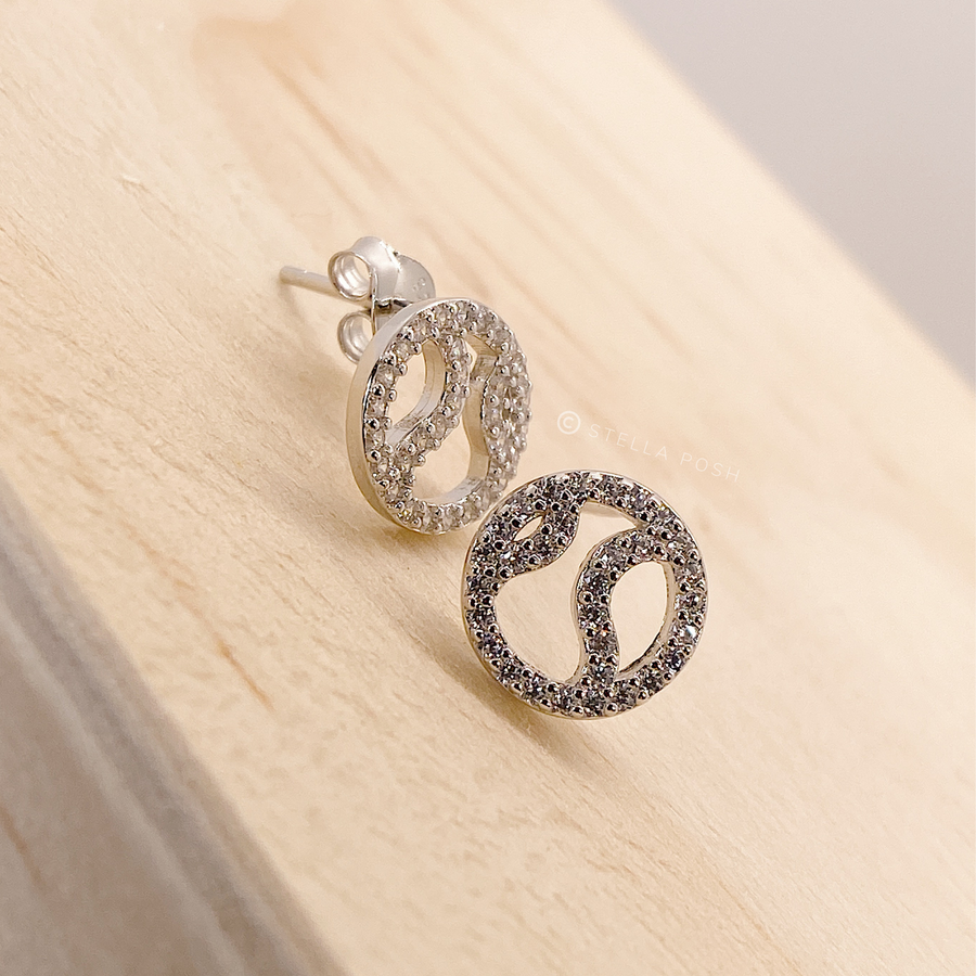 Tiny .925 Sterling Silver Tennis Earrings with premium cubic zirconia stones in a pavé setting.