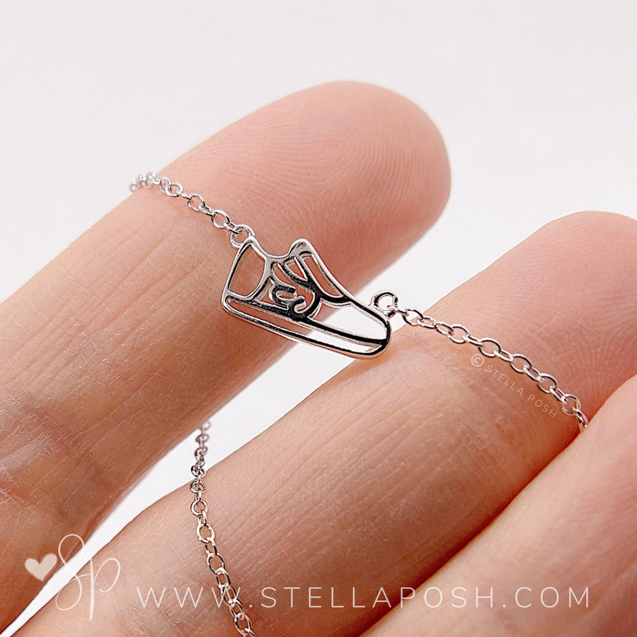 .925 silver Dainty Runner Necklace, held in hand for scale.