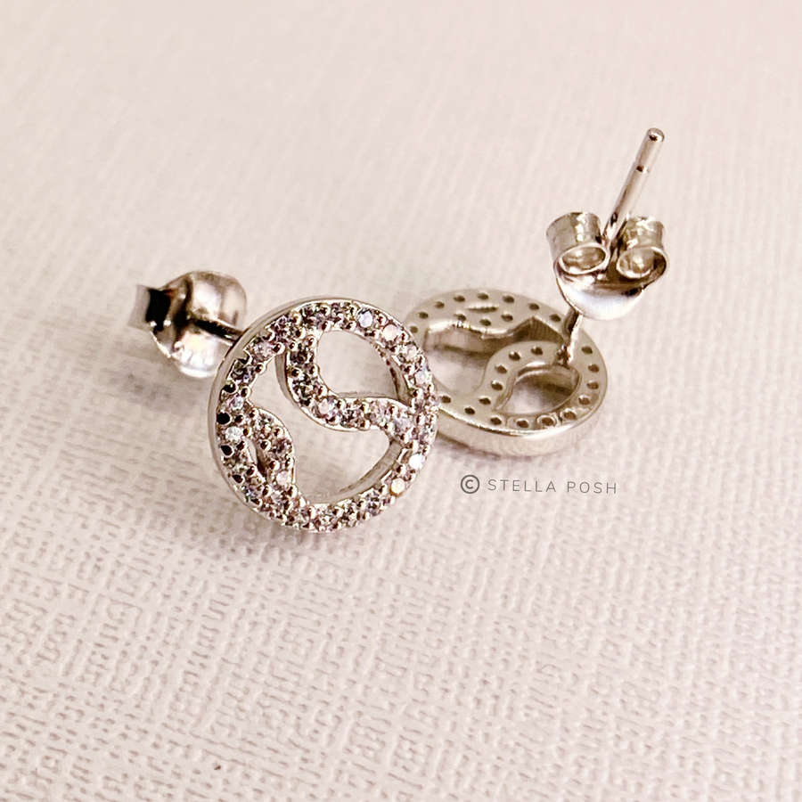 Tiny .925 Sterling Silver Tennis Earrings with premium cubic zirconia stones in a pavé setting.