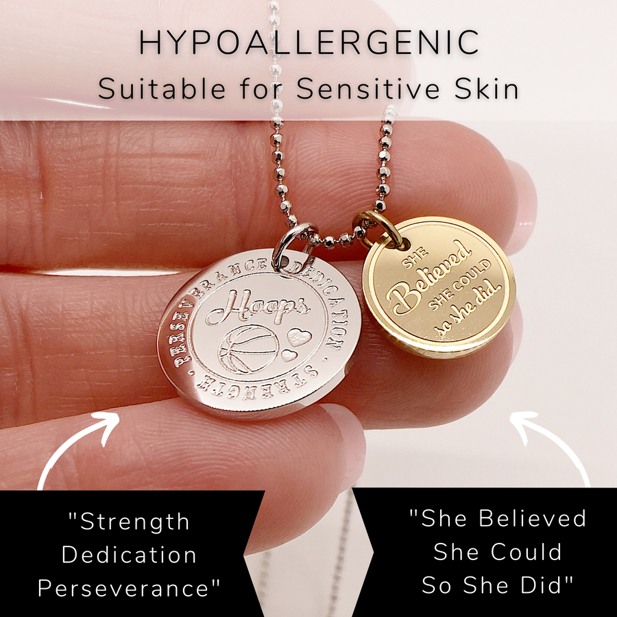 Detailed hypoallergenic Basketball Charm Necklace with 14K Gold plated or Rhodium plated 'Basketball' charm, and 'She believed she could so she did' charm.
