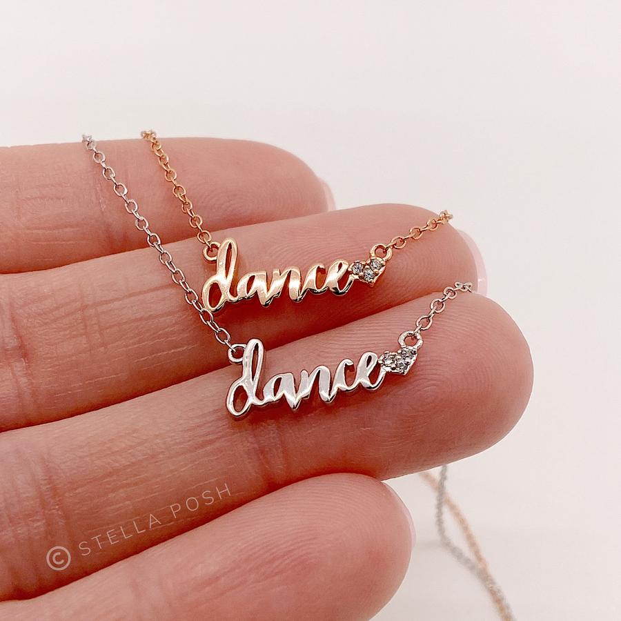 Dainty .925 silver Dance Necklaces with premium cubic zirconias, in silver and gold, Held in Hand for Scale.