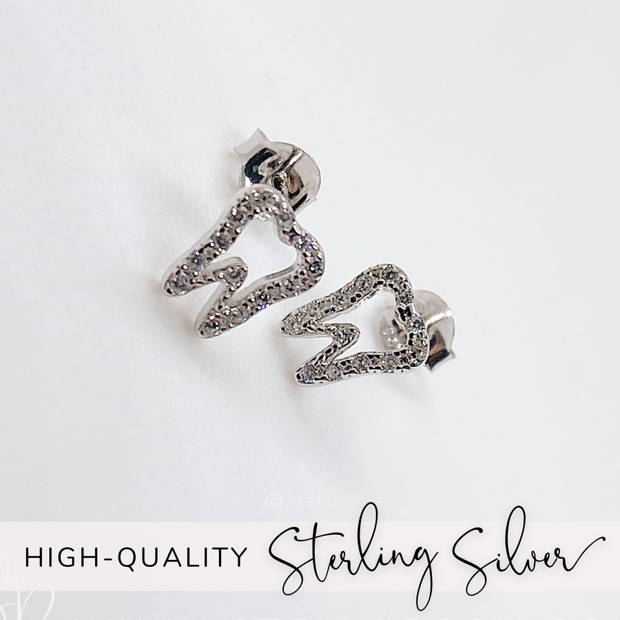 Tiny .925 Sterling Silver Tooth Earrings with premium cubic zirconia stones in a pavé setting.
