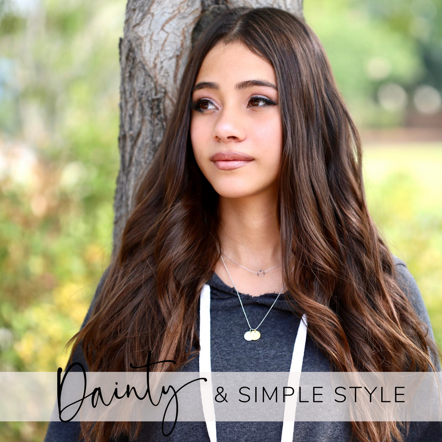 Brunette Teen Model wearing Charm necklace layered with .925 silver necklace.