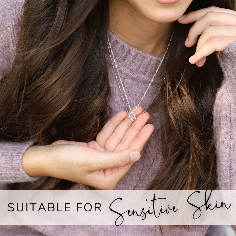 Model wearing adjustable Dainty .925 silver Tooth Necklace, suitable for sensitive skin.