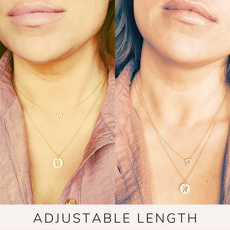  Model wearing Adjustable Tiny Tooth .925 sterling silver necklace, layered with a Tooth Disc necklace.