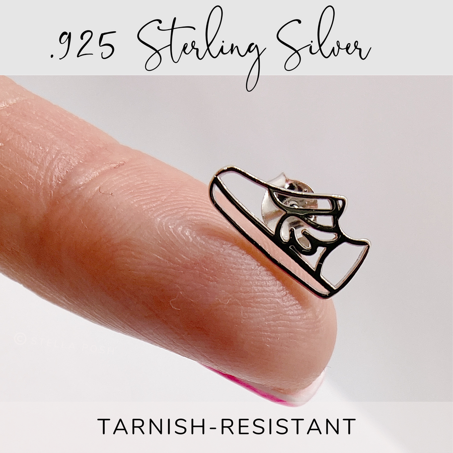 Dainty .925 Sterling Silver Running Shoe Earring held on finger for scale.