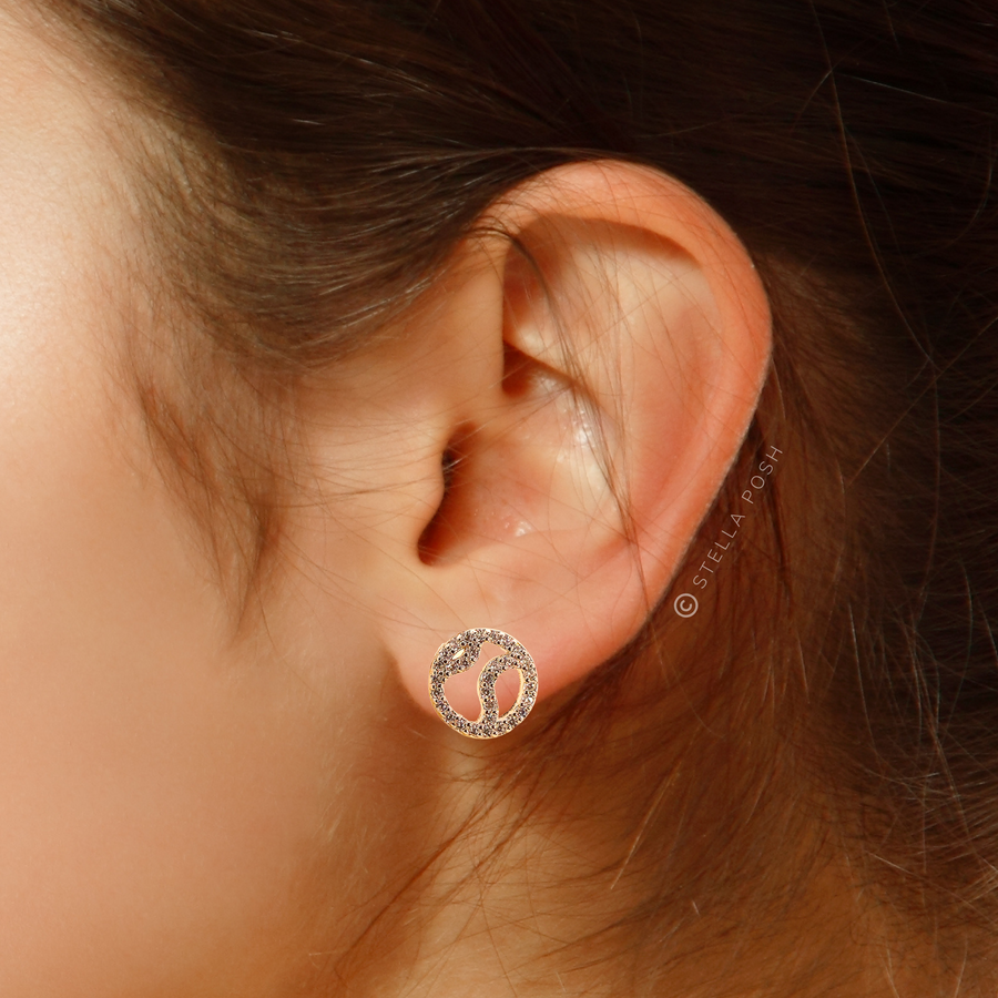 Model wearing Tiny .925 Sterling Silver Tennis Earring with premium cubic zirconia stones in a pavé setting.