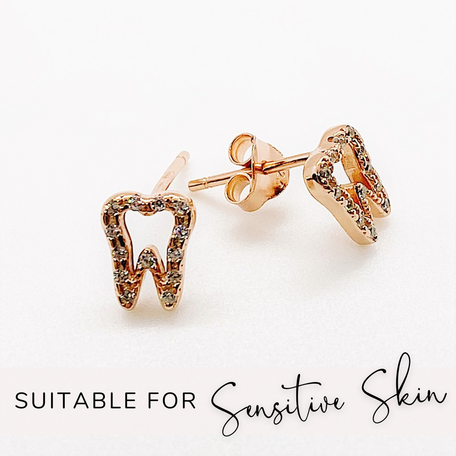 Tiny .925 Sterling Silver Tooth Earrings with premium cubic zirconia stones in a pavé setting in rose gold, suitable for sensitive ears.