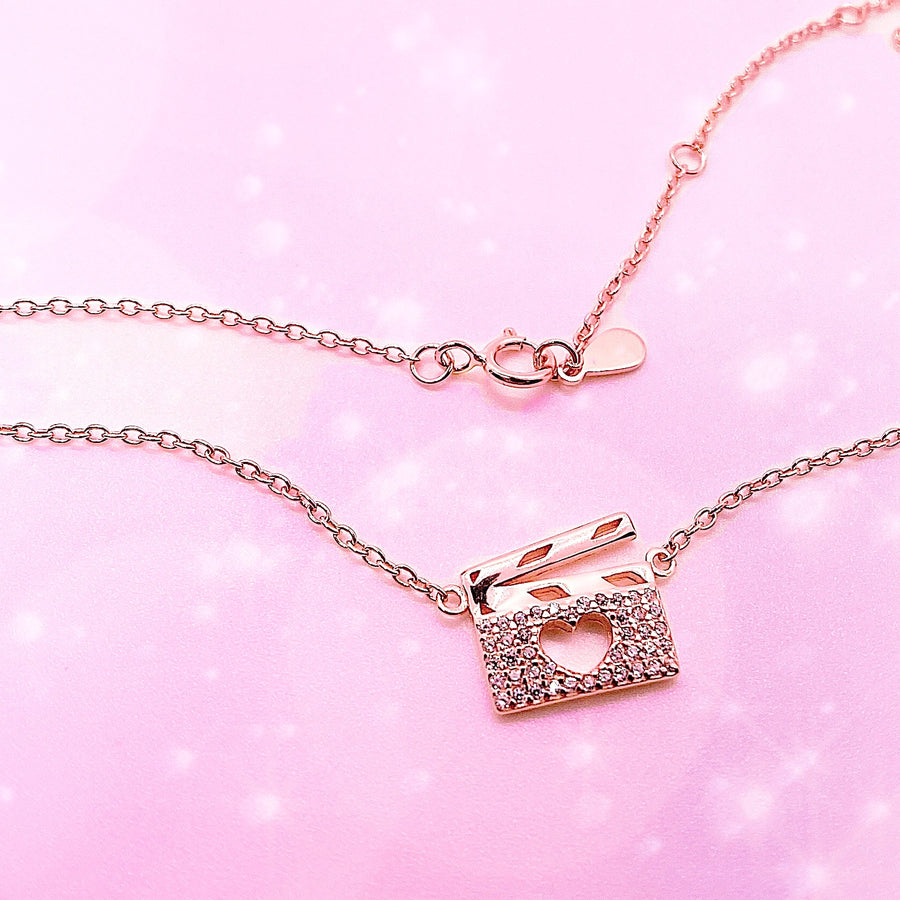 .925 silver Drama Theater Necklace in gold, with premium cubic zirconias.