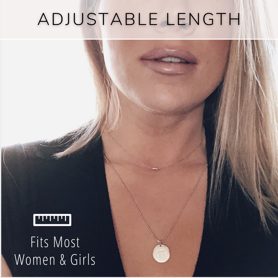 Model wearing the adjustable length, dainty Charm Necklace.
