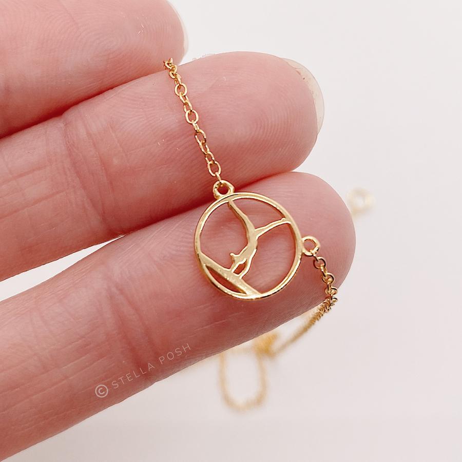 Dainty .925 silver Gymnastics Necklace in gold, Held in Hand for Scale.