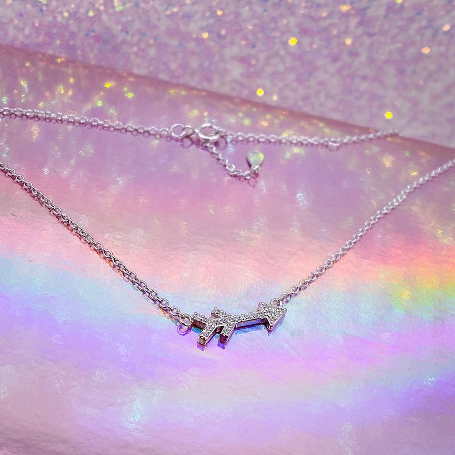 Tiny Arrow .925 Sterling Silver necklace with premium cubic zirconias in a pavé setting.