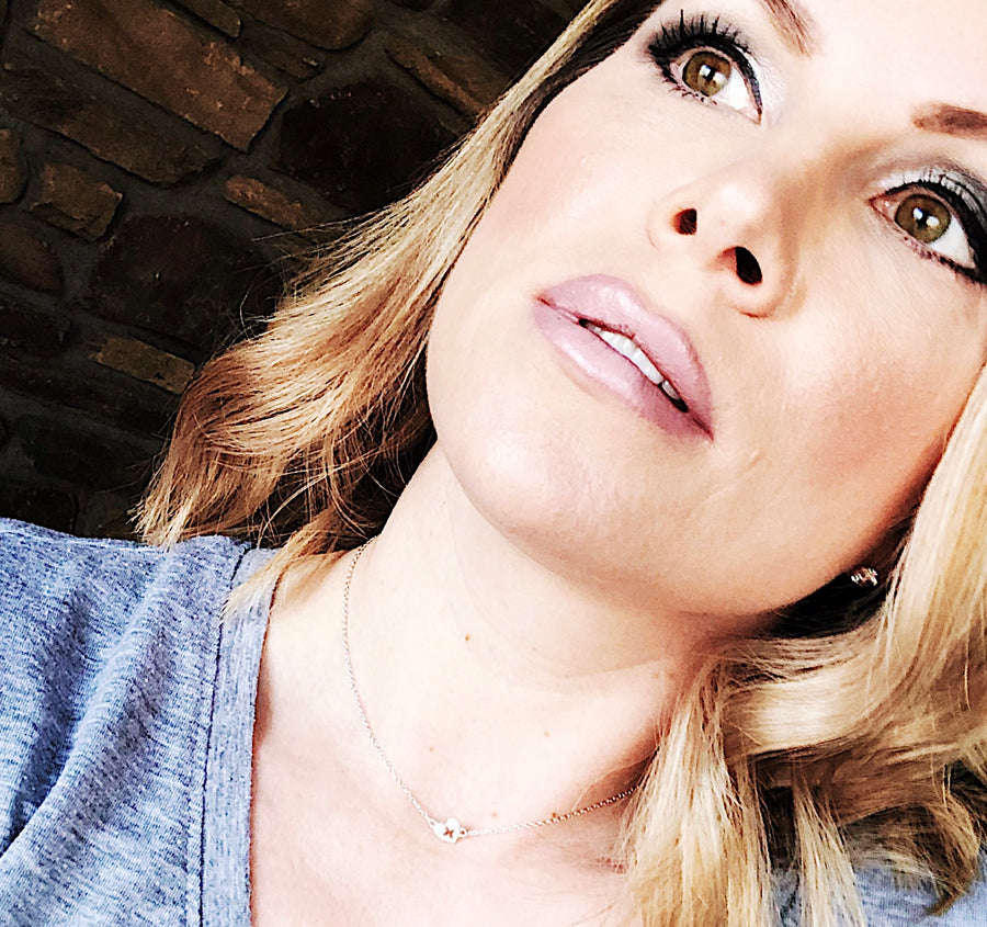 Model wearing Tiny .925 silver Nurse Necklace with premium cubic zirconias.