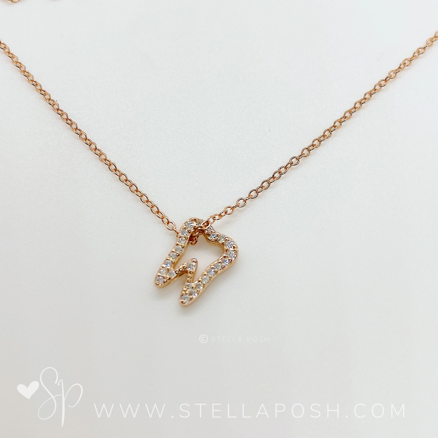 .925 silver Tooth Necklace in gold.