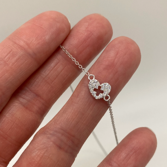 .925 silver Nurse Necklace with premium cubic zirconias, held in hand for scale.